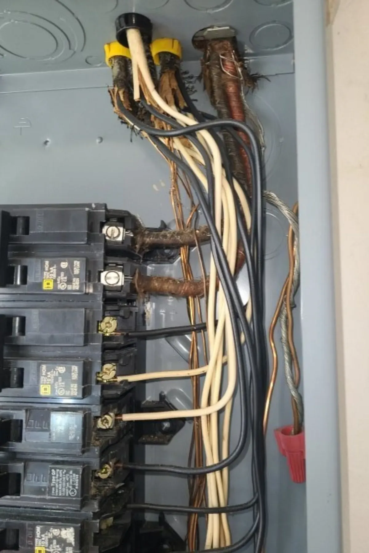 Deteriorated cloth-insulated wiring in an older electrical panel found during a 4-Point inspection